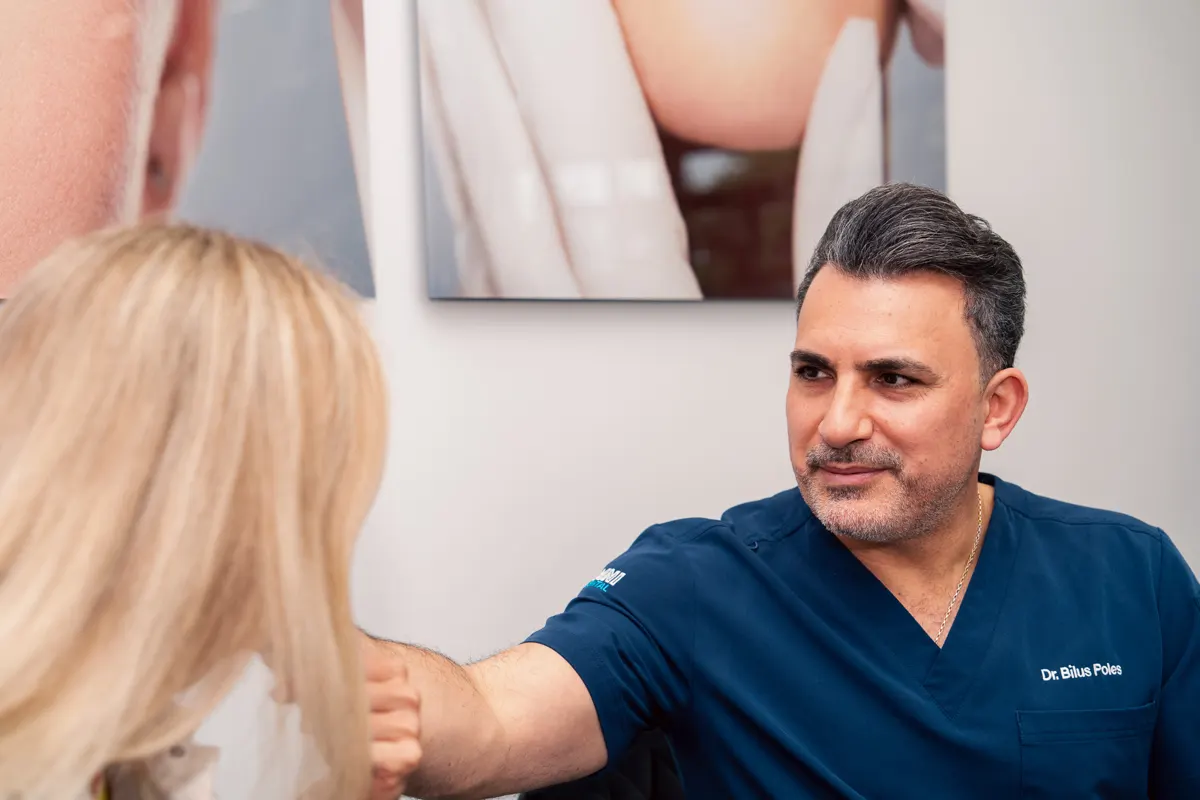 Dr. Bilus Poles explaining a dental implant plan to a patient at Omni Dental in Arlington Heights