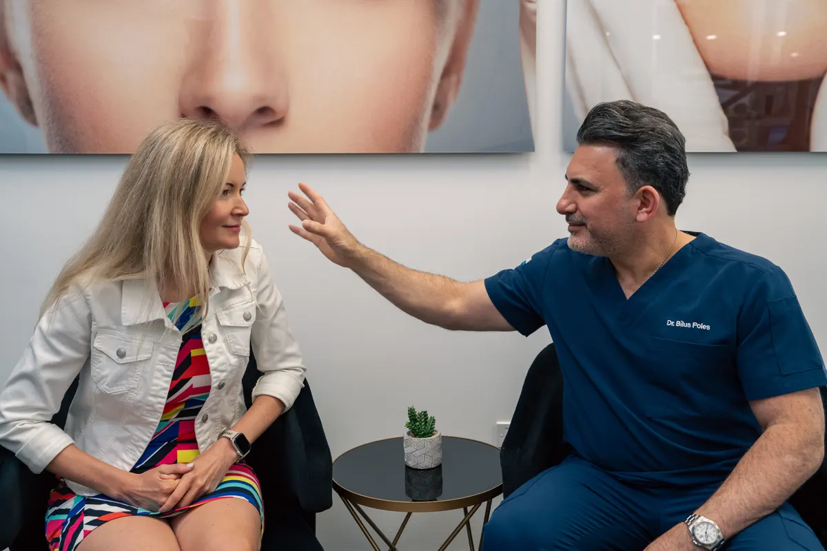 Dr. Bilus Poles explaining restorative options to a patient at Omni Dental in Arlington Heights, IL